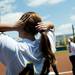 Michigan junior Caitlin Blanchard fixes her hair before the game against Louisiana-Lafayette on Friday, May 24. Daniel Brenner I AnnArbor.com